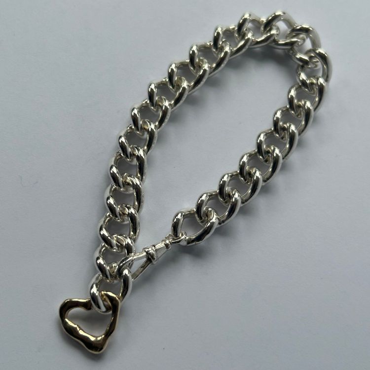 Vintage heavy silver bangle with integrated Lulu and Boo molten 9ct gold heart