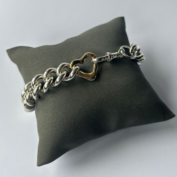 Vintage heavy silver bangle with integrated Lulu and Boo molten 9ct gold heart