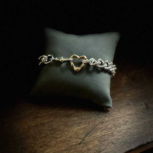 Vintage heavy silver bangle with integrated Lulu and Boo molten 9ct gold heart