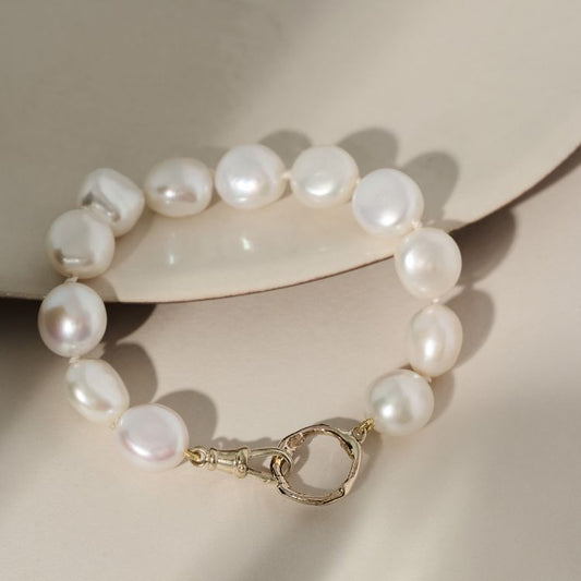 A Pearl Bracelet 18ct Gold Small Halo from Lulu and Boo Jewellery.