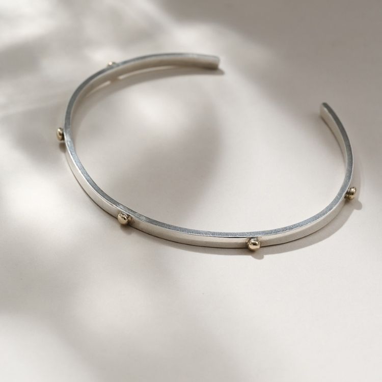 Marianne Silver and 9ct Gold Cuff Bracelet from Lulu and Boo Jewellery.