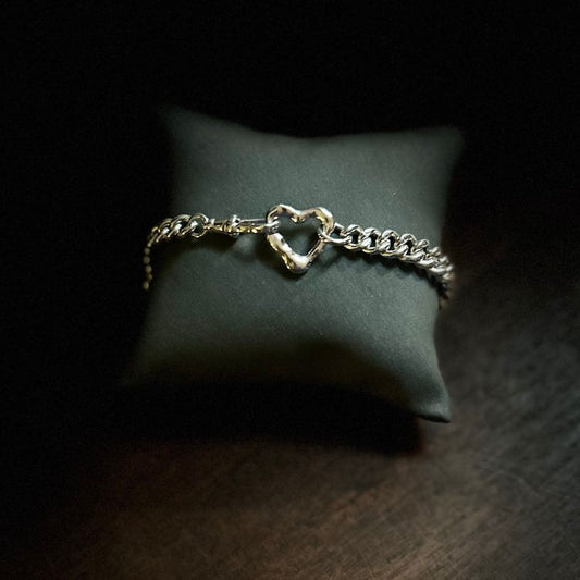 Vintage silver bangle with integrated Lulu and Boo molten 9ct gold heart