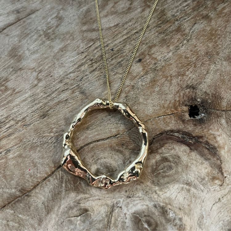 A Molten 9ct Gold Halo Necklace from Lulu and Boo Jewellery.