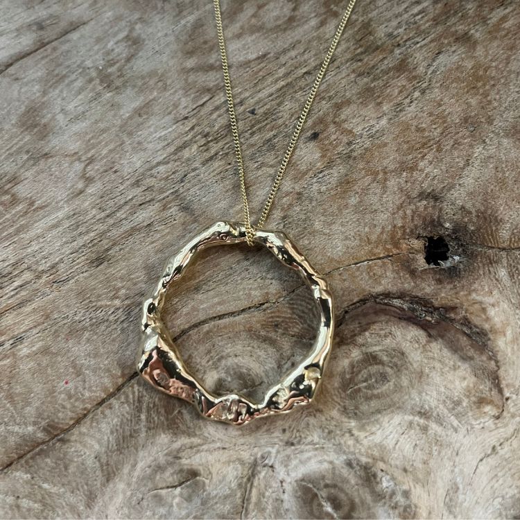 An 18ct gold pendant necklace from Lulu and Boo Jewellery.
