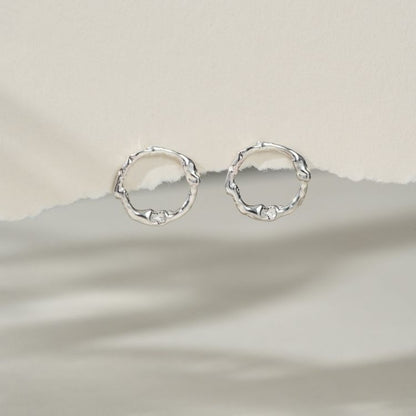 A pair of Silver Halo Stud Earrings from Lulu and Boo Jewellery.