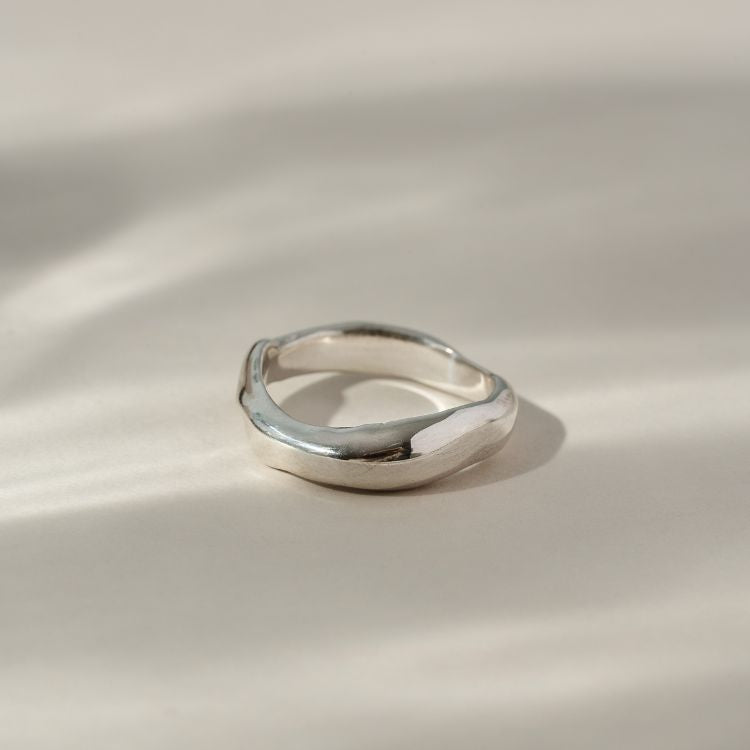 A Men’s sterling silver ring - Molten Small from Lulu and Boo Jewellery.
