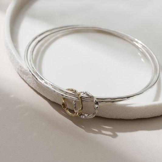 Molten hoops bangle in silver and 9ct gold
