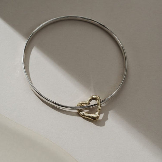 Sterling silver and 9ct gold Molten Heart charm bangle