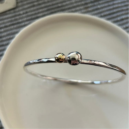 Silver bracelet with silver and brass bobble detail 6.5cm diameter