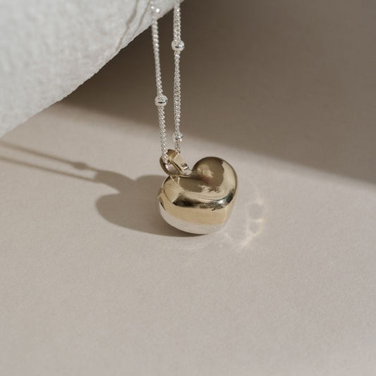 You and Me puffy heart pendant. 9ct gold and sterling silver fused heart pendant.