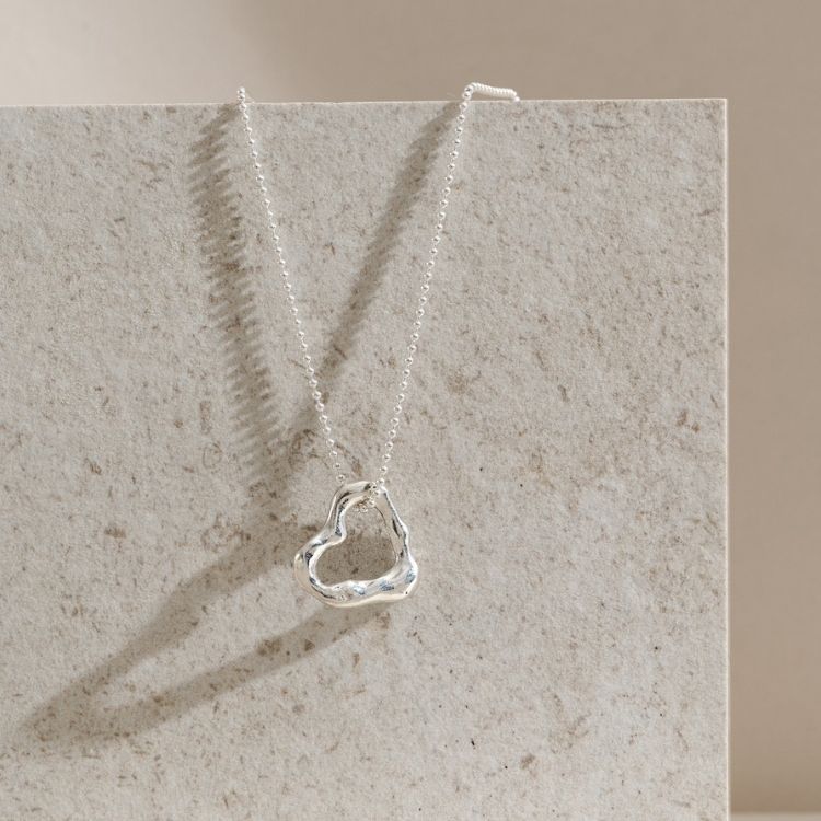 A Molten Sterling Silver Small Heart Necklace from Lulu and Boo Jewellery.