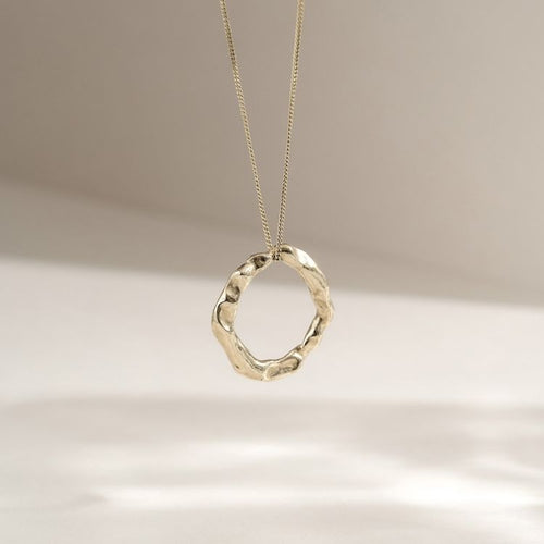 A Gold Halo Pendant  from Lulu and Boo Jewellery.
