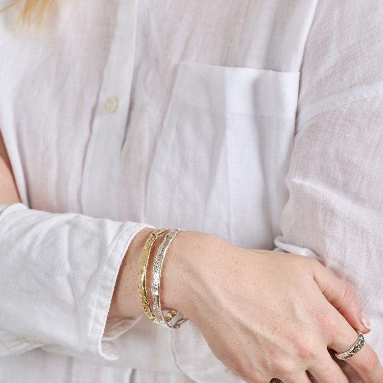 Luna Textured Gold Bangle and silver bangle from Lulu and Boo Jewellery.
