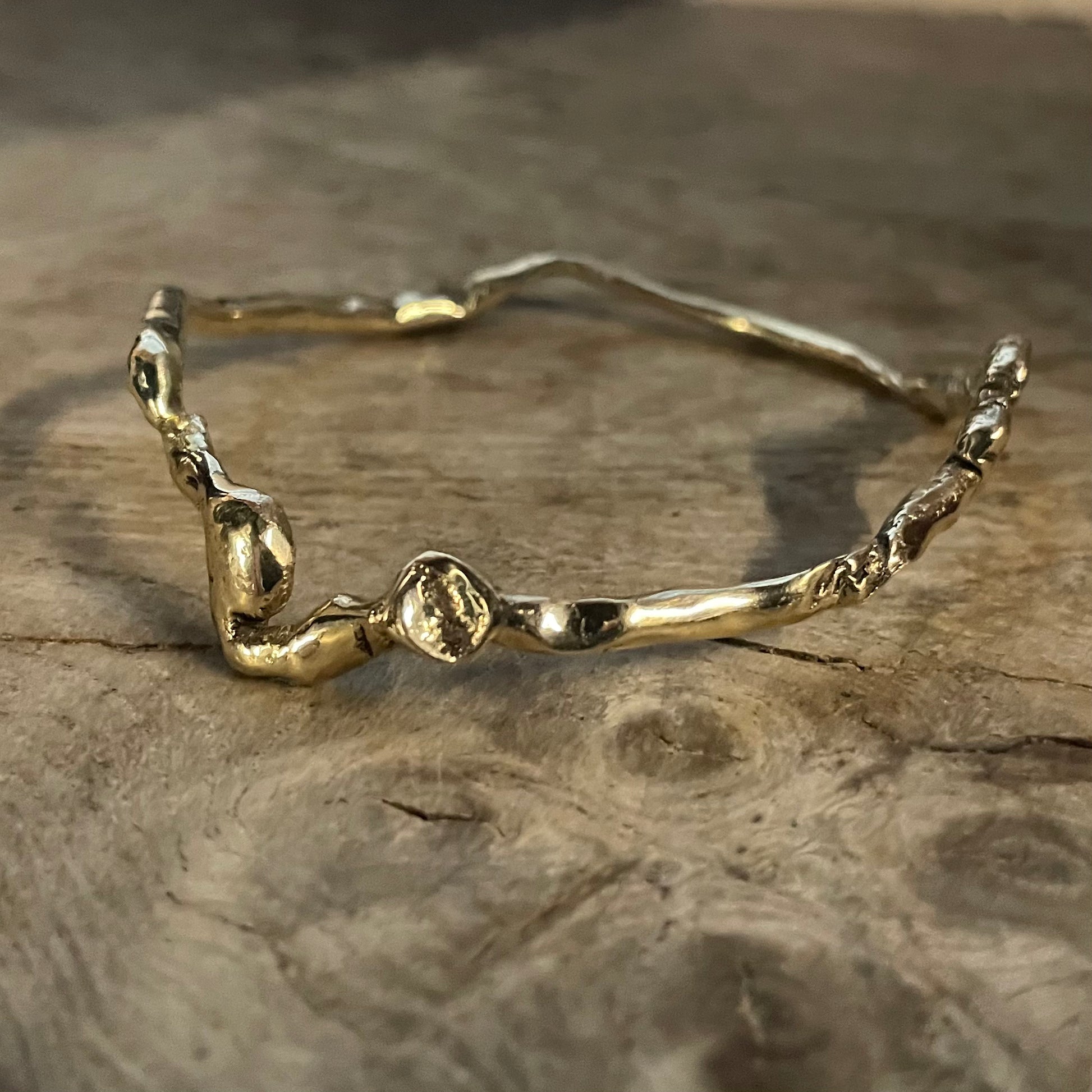 A Wiggle Molten Gold 9ct Bangle from Lulu and Boo Jewellery.