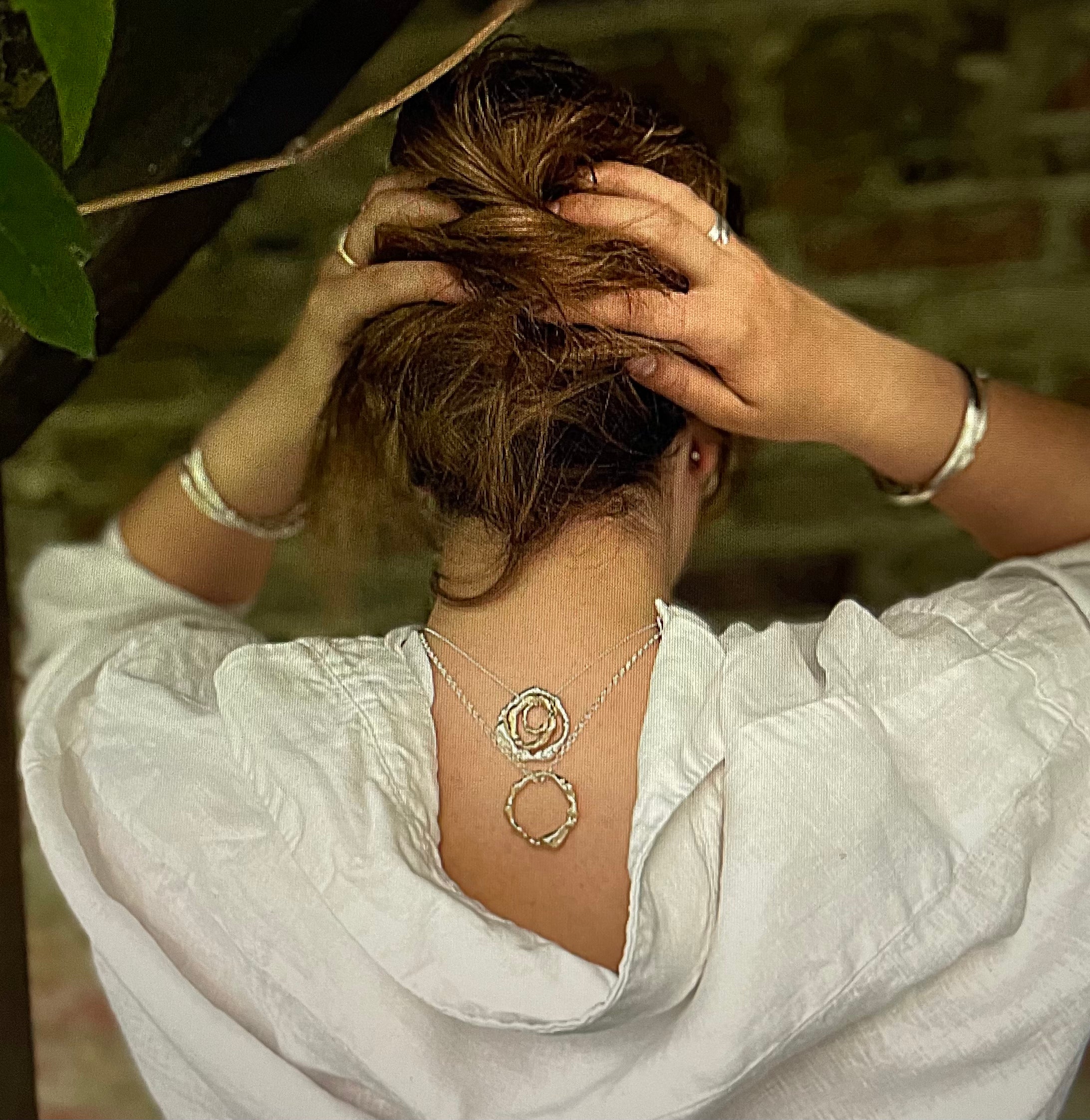 An 18ct Gold Necklace with Pendant from Lulu and Boo Jewellery.

