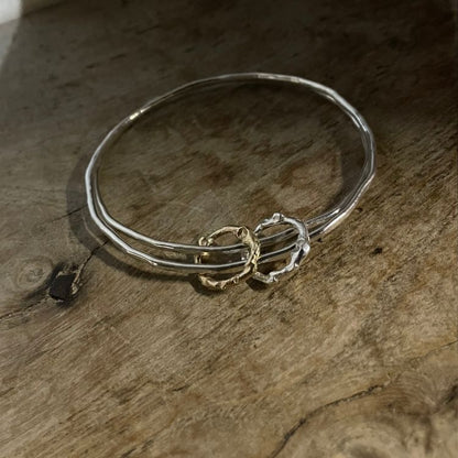 Molten hoops bangle in silver and 9ct gold