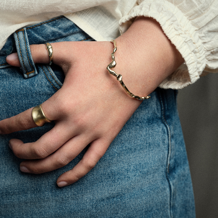 A Wiggle Molten Gold 9ct Bangle from Lulu and Boo Jewellery.